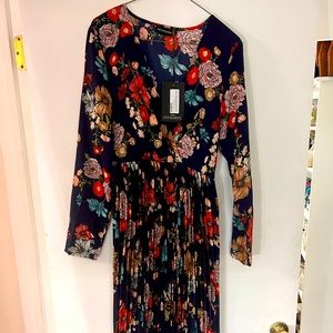 Three quarter sleeve midi dress, never worn tags still on. Tie wrap for waist